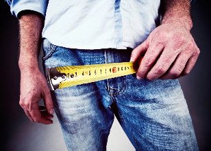 The man measured his penis with a measuring tape